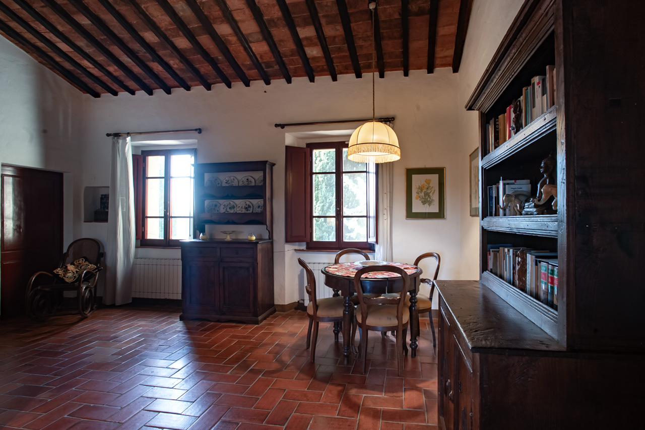 Dining room with terracotta floor and wooden beam ceiling